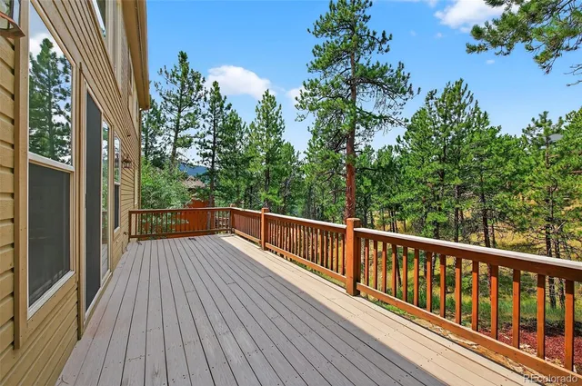 a view of balcony with deck and wooden floor