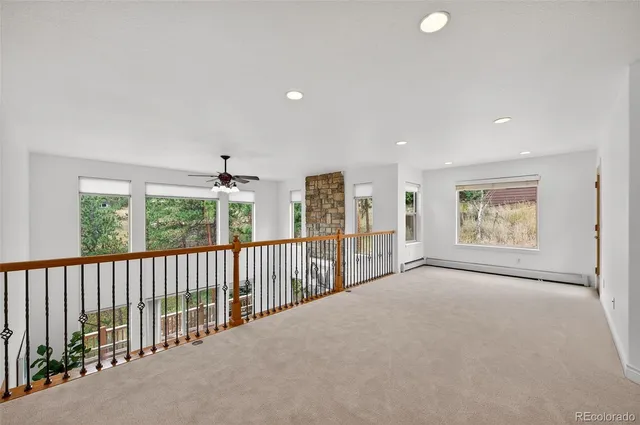 a view of a big room with windows