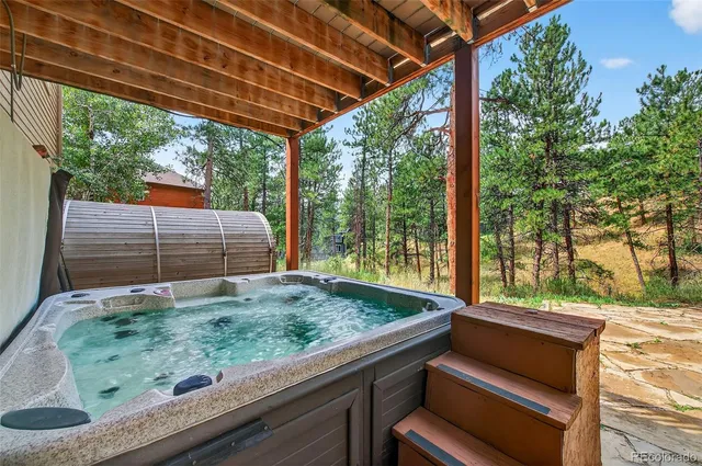 a view of backyard with green space and seating area