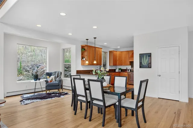 a view of a dining room with furniture and wooden floor
