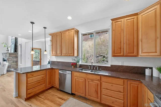 a kitchen with sink cabinets and window