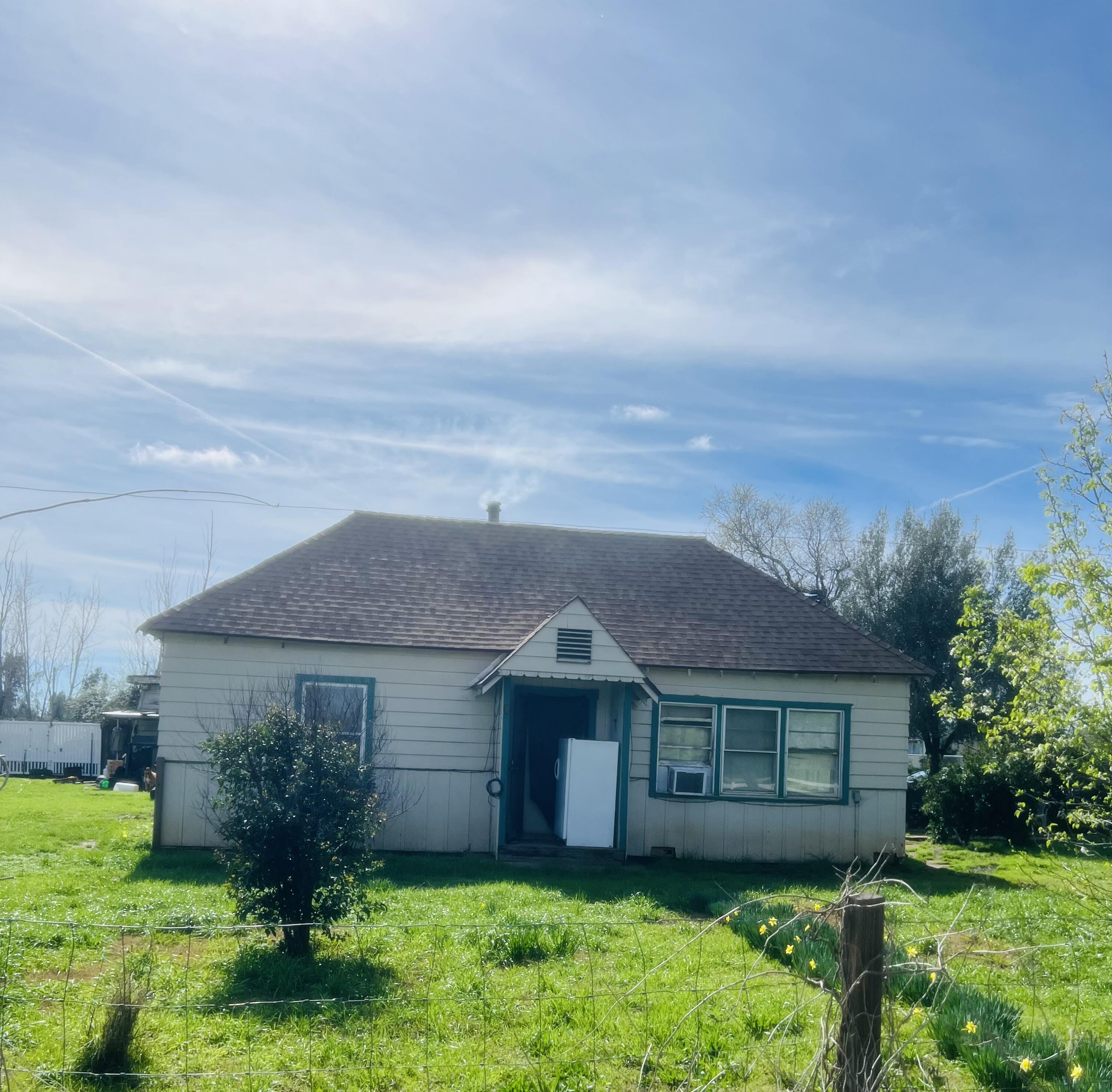 5243 Poplar Avenue Anderson, CA 96007 - Photo 1 of 11 front view of house with a yard