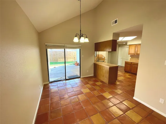 a view of a kitchen with a sink and a window