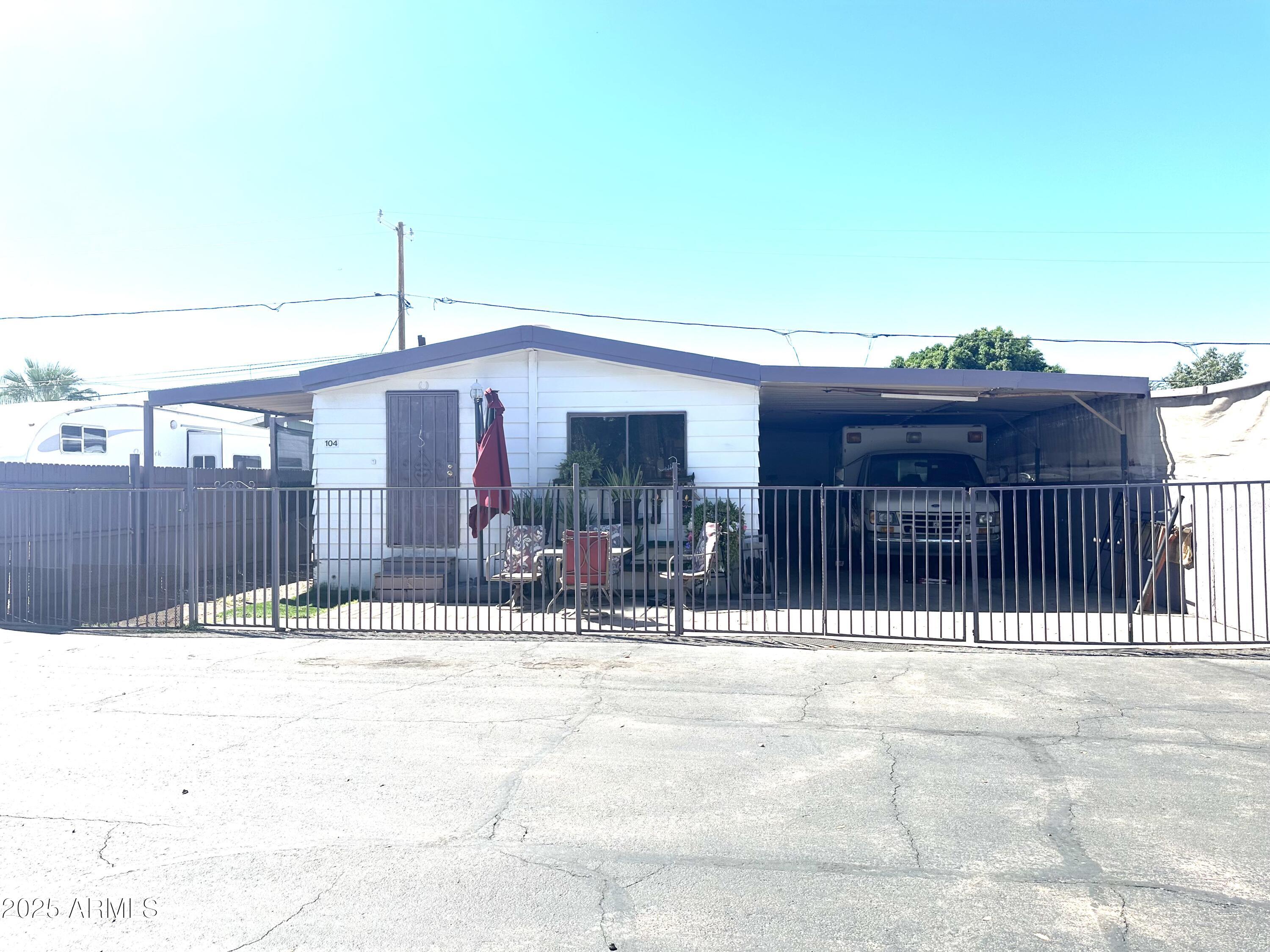a view of a patio with a table and chairs
