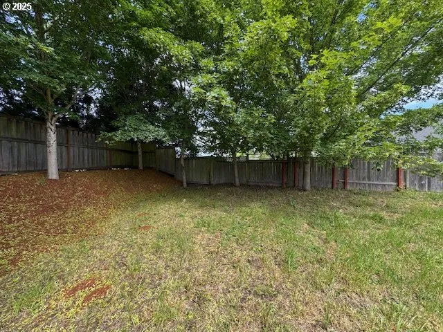 a backyard of a house with lots of green space