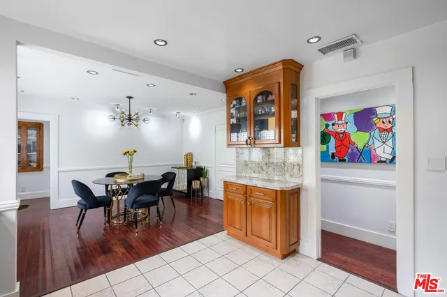 a view of a dining room with furniture kitchen and wooden floor