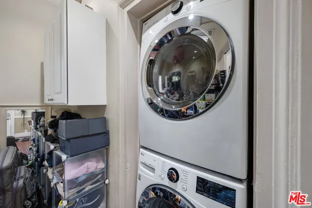 a view of storage and utility room with washer and dryer