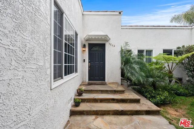 a front view of a house with stairs