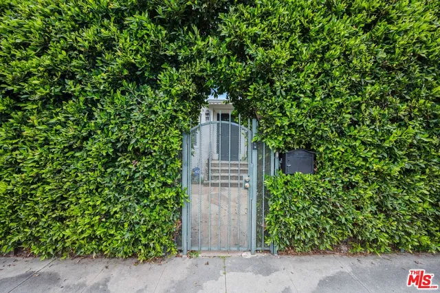 a swimming pool with outdoor seating and yard