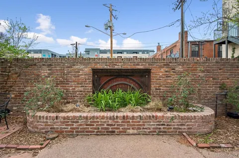 a view of a house with an iron gate