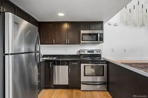 a kitchen with a stove microwave and refrigerator