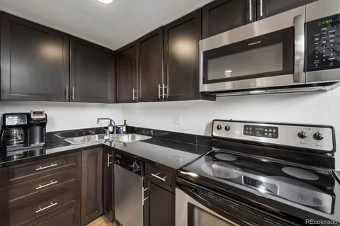 a kitchen with a stove and a microwave