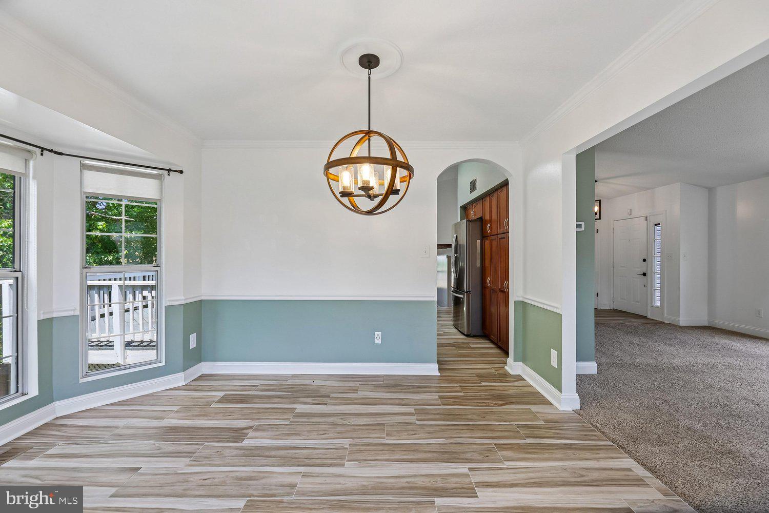 15764 Beau Ridge Drive Woodbridge, VA 22193 - Photo 9 of 58 a view of a hallway with wooden floor and windows