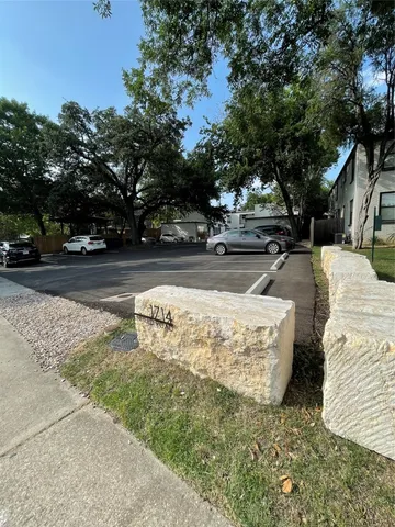 a view of a yard with a tree