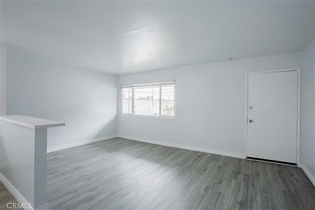 a view of kitchen with wooden floor