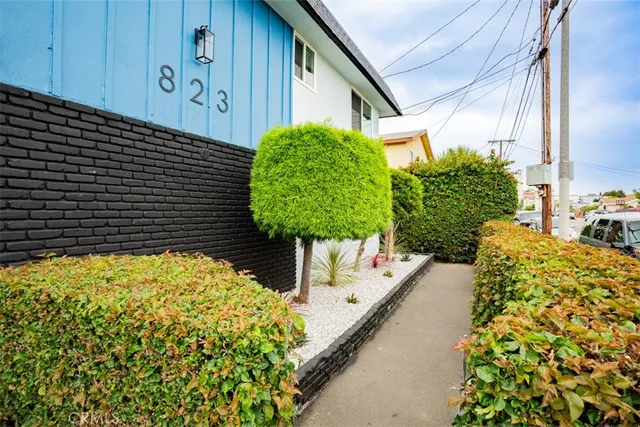 a front view of building with parking space