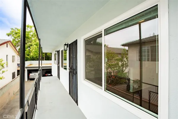 a view of a living room and a balcony