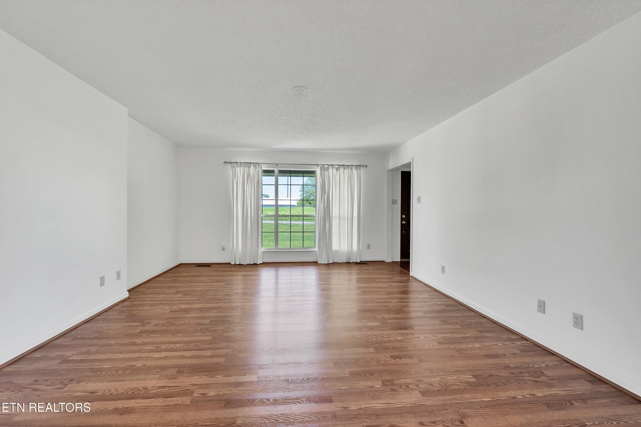 2036 Little Best Road Maryville, TN 37803 - Photo 39 of 54 a view of an empty room with wooden floor and a window