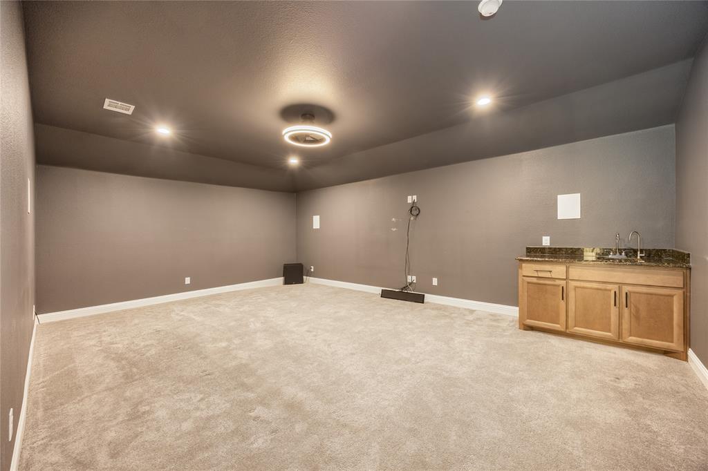 918 Sydney Lane Allen, TX 75013 - Photo 24 of 40 Entertainment room with carpeted flooring, a neutral wall color, and recessed lighting