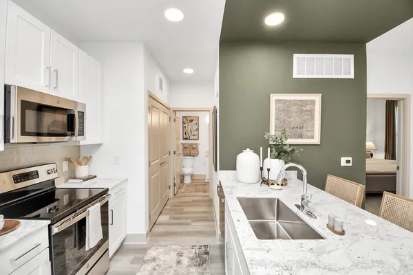 a kitchen with a stove and a sink