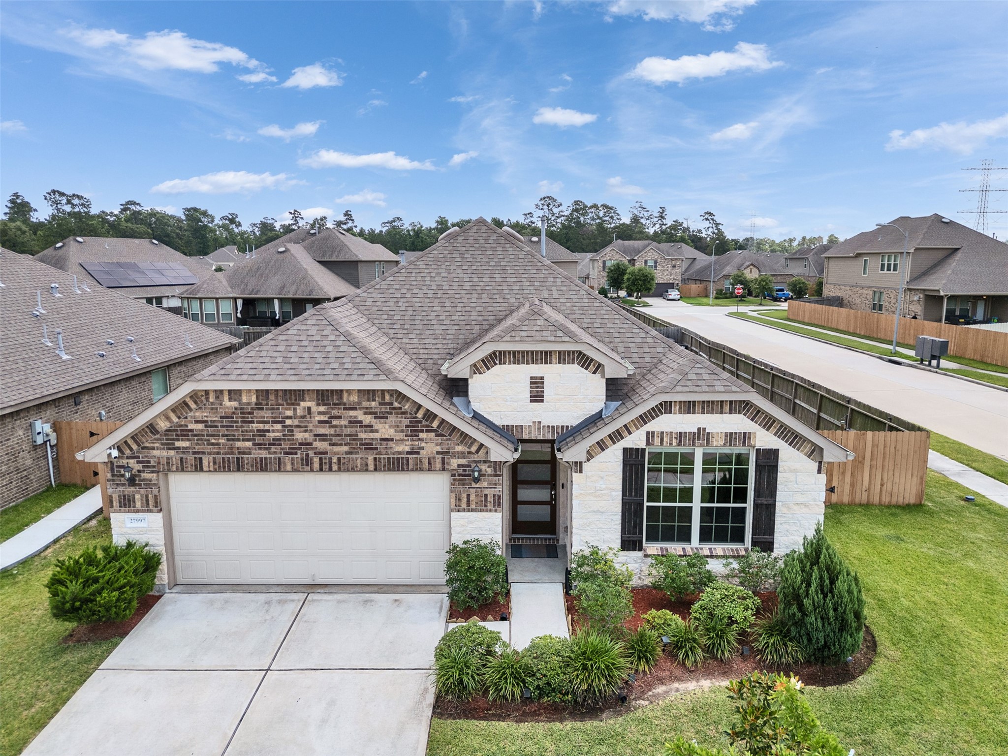 27997 Lone Hollow Lane Spring, TX 77386 - Photo 2 of 45 a view of a house with a yard