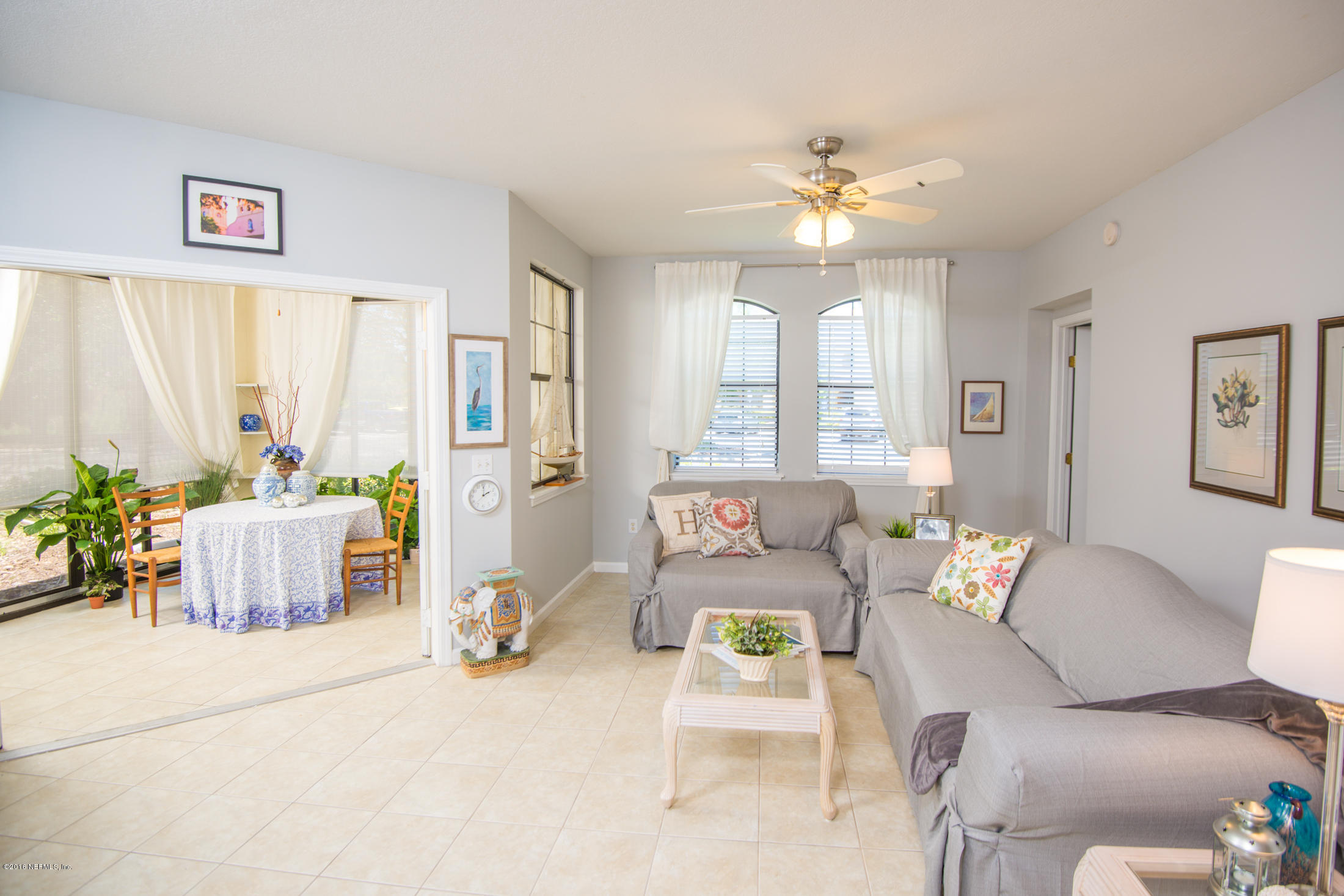 3210 Haley Pointe Road St. Augustine, FL 32084 - Photo 13 of 44 a living room with furniture and a chandelier