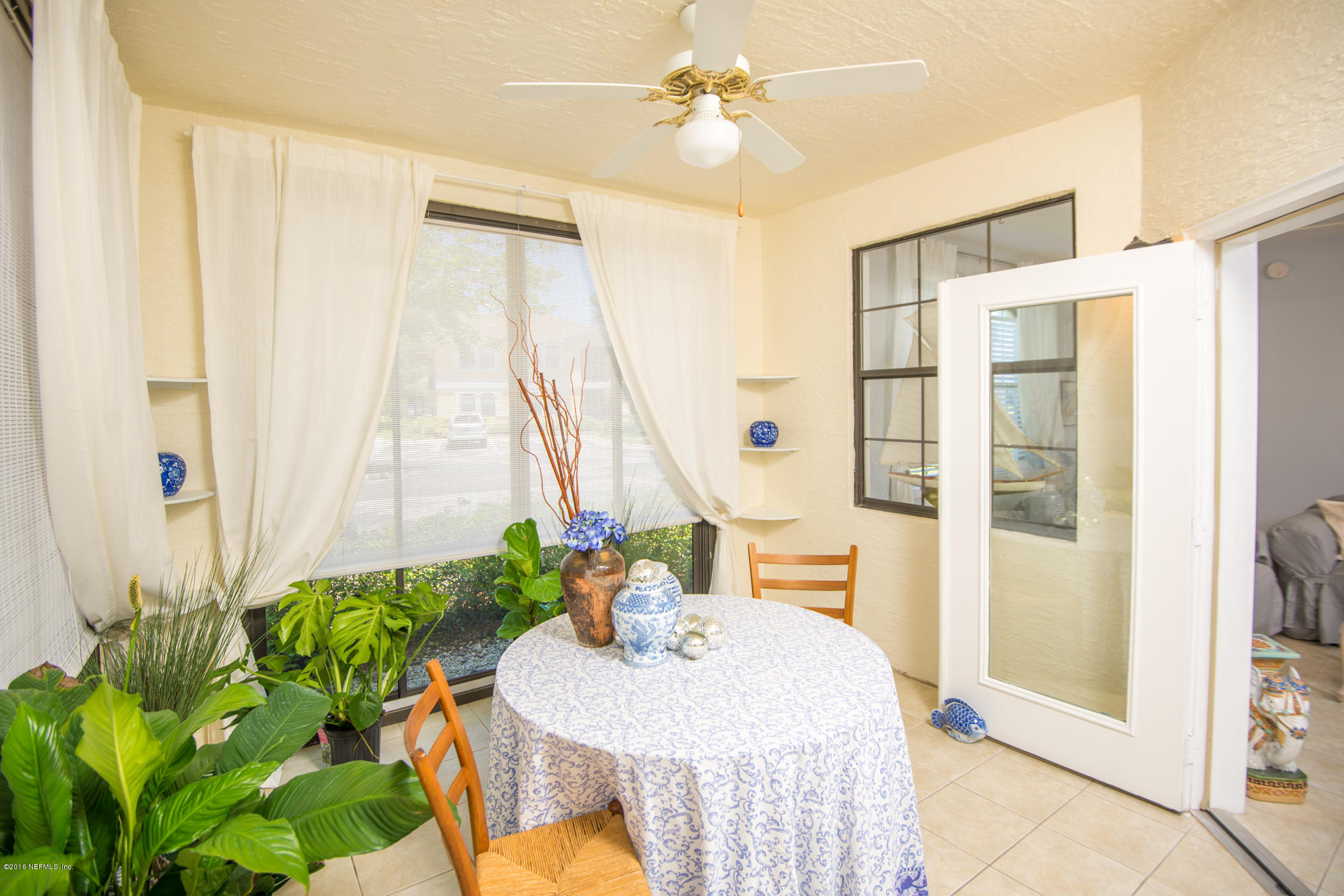 3210 Haley Pointe Road St. Augustine, FL 32084 - Photo 15 of 44 a very nice looking room with a large window a couch and table