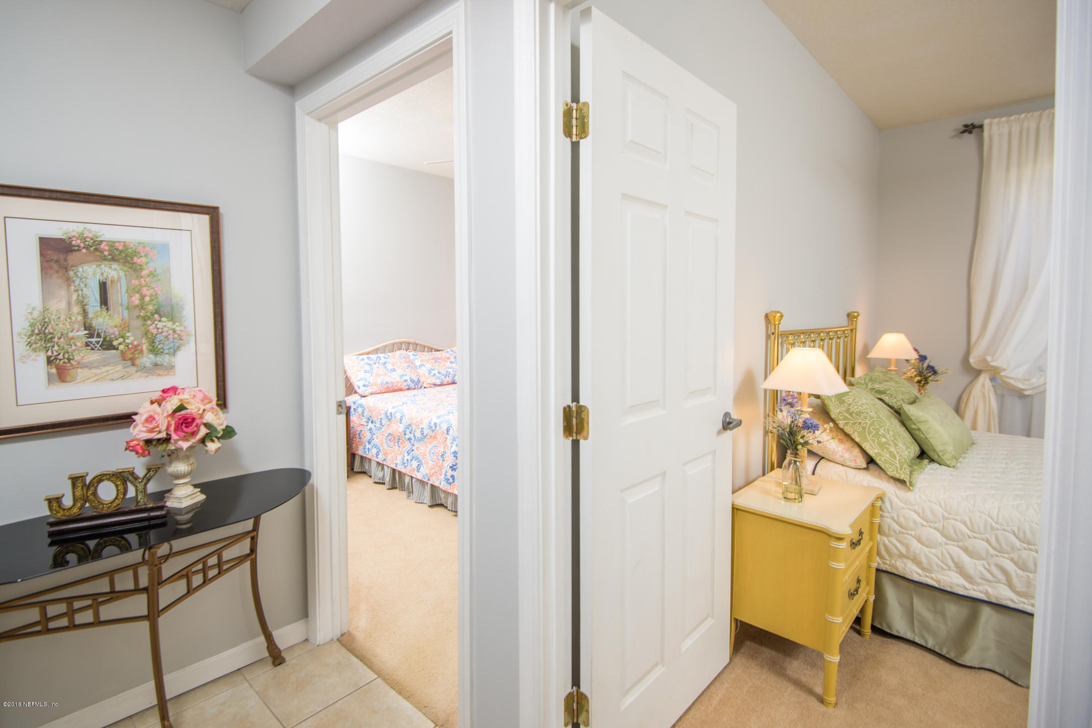 3210 Haley Pointe Road St. Augustine, FL 32084 - Photo 28 of 44 a bedroom with a bed and furniture