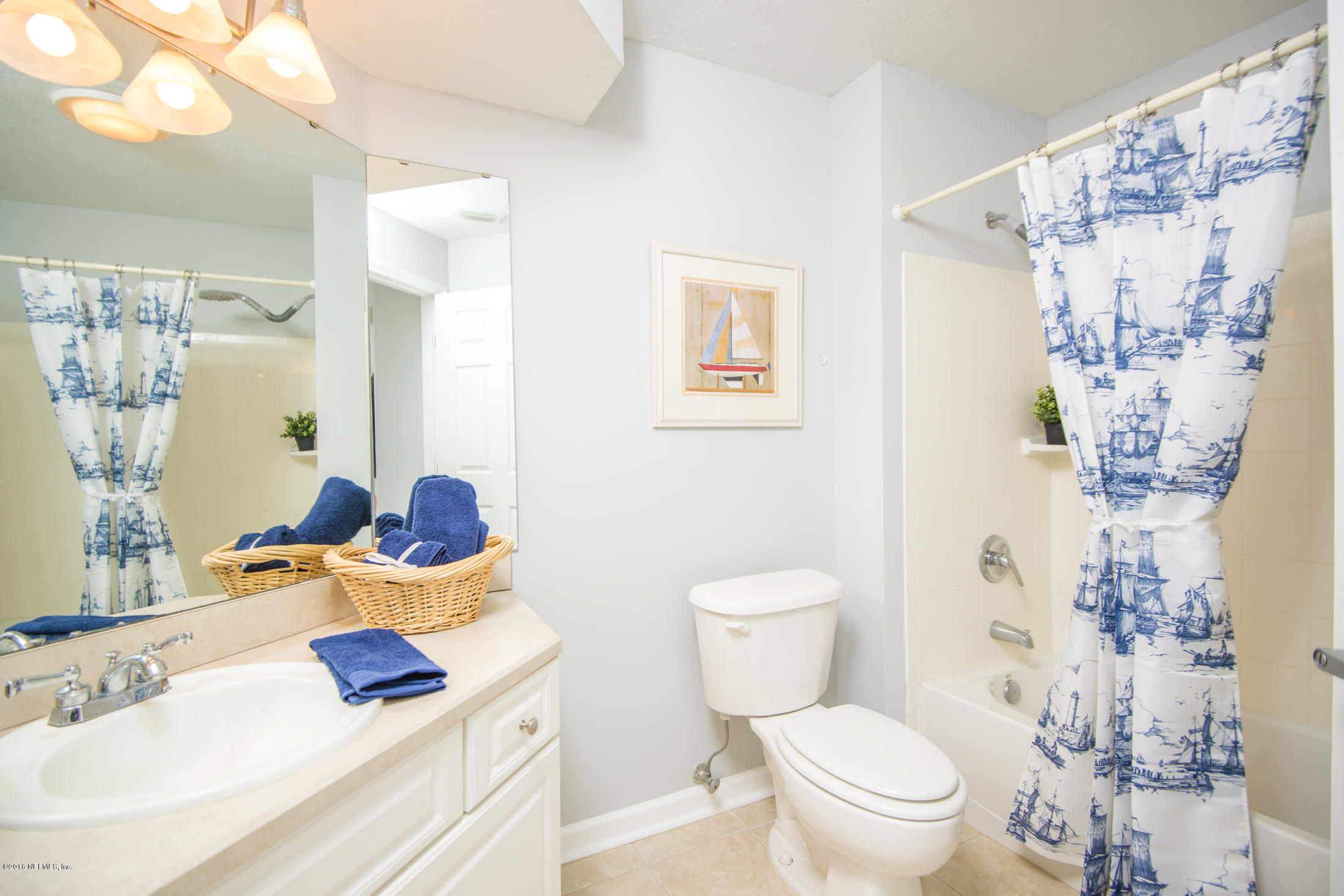 3210 Haley Pointe Road St. Augustine, FL 32084 - Photo 32 of 44 a white toilet sitting next to a bathroom sink