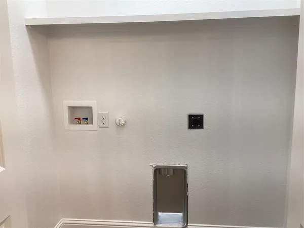 a bathroom with a shower and a sink