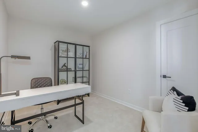 a view of a hallway with washer and dryer