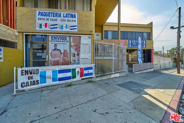 a view of shops on a street