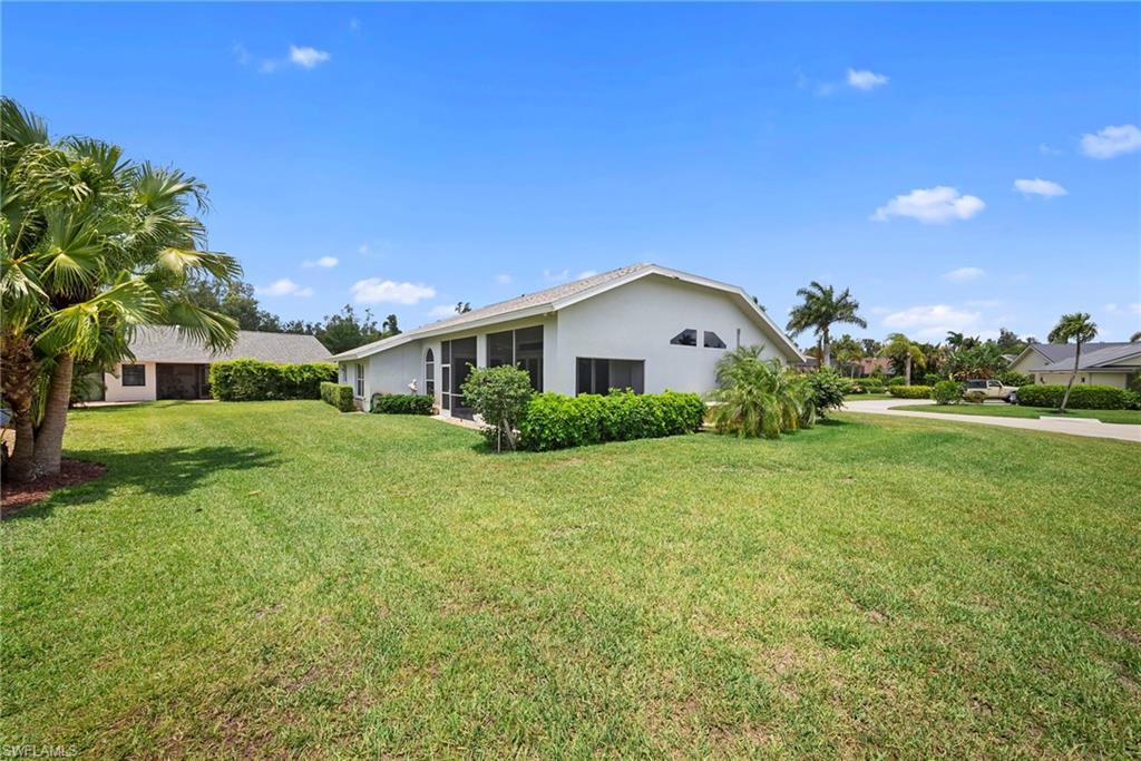 3971 Spring Garden Lane Estero, FL 33928 - Photo 24 of 31 a view of a house with a big yard