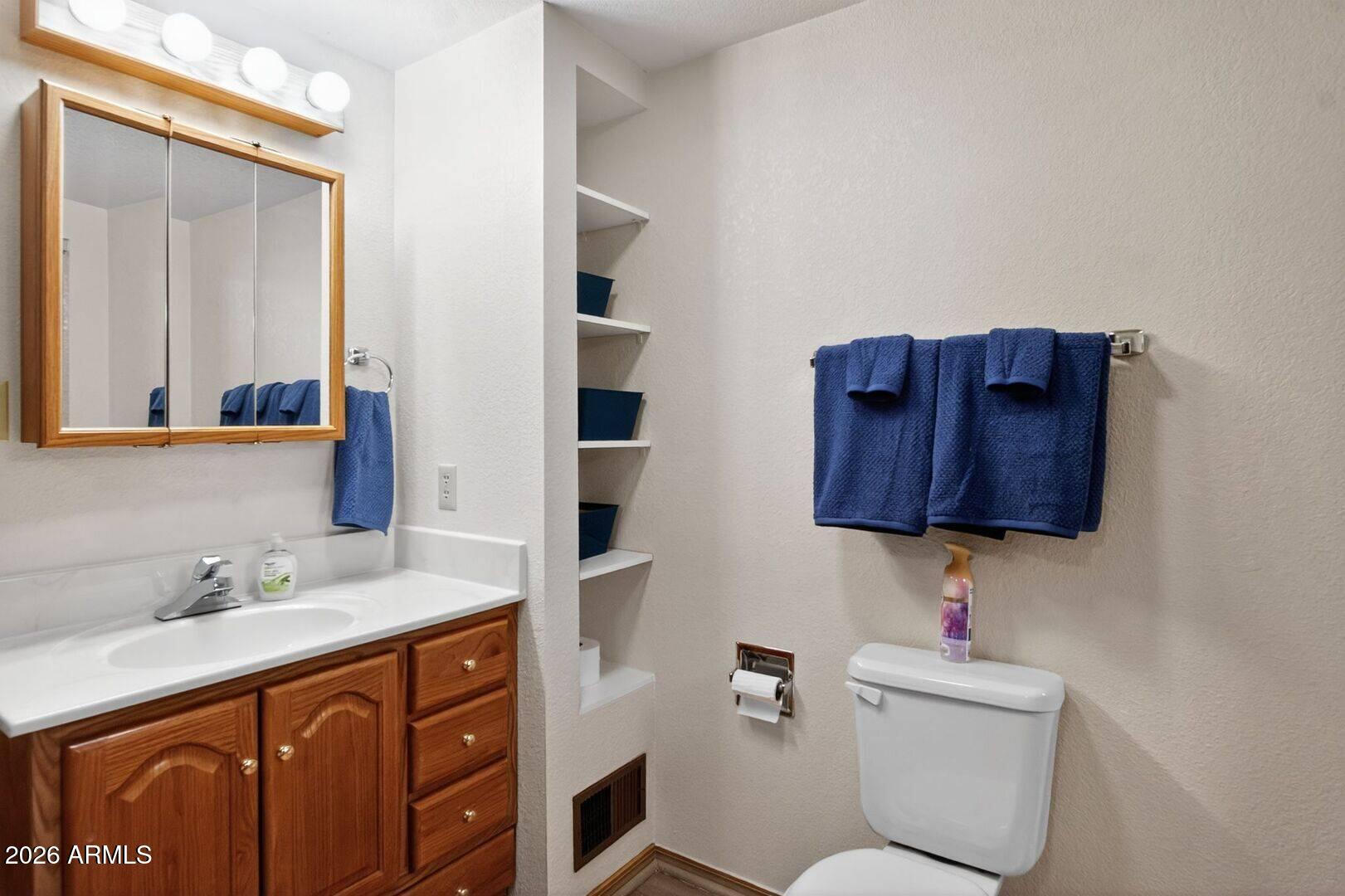 8884 Tonto Rim Drive Pine, AZ 85544 - Photo 38 of 43 a bathroom with a sink a toilet and shower