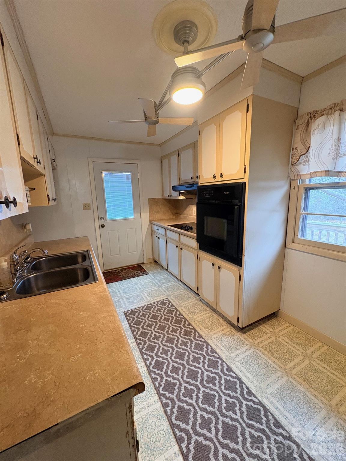 3955 Tower Road Maiden, NC 28650 - Photo 11 of 45 a kitchen with stainless steel appliances a stove a sink and a refrigerator
