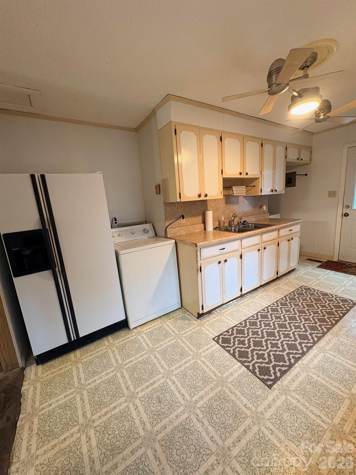 3955 Tower Road Maiden, NC 28650 - Photo 12 of 45 a large kitchen with a stove a sink dishwasher and a refrigerator