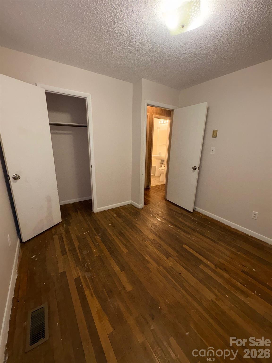 3955 Tower Road Maiden, NC 28650 - Photo 16 of 45 an empty room with wooden floor and closet