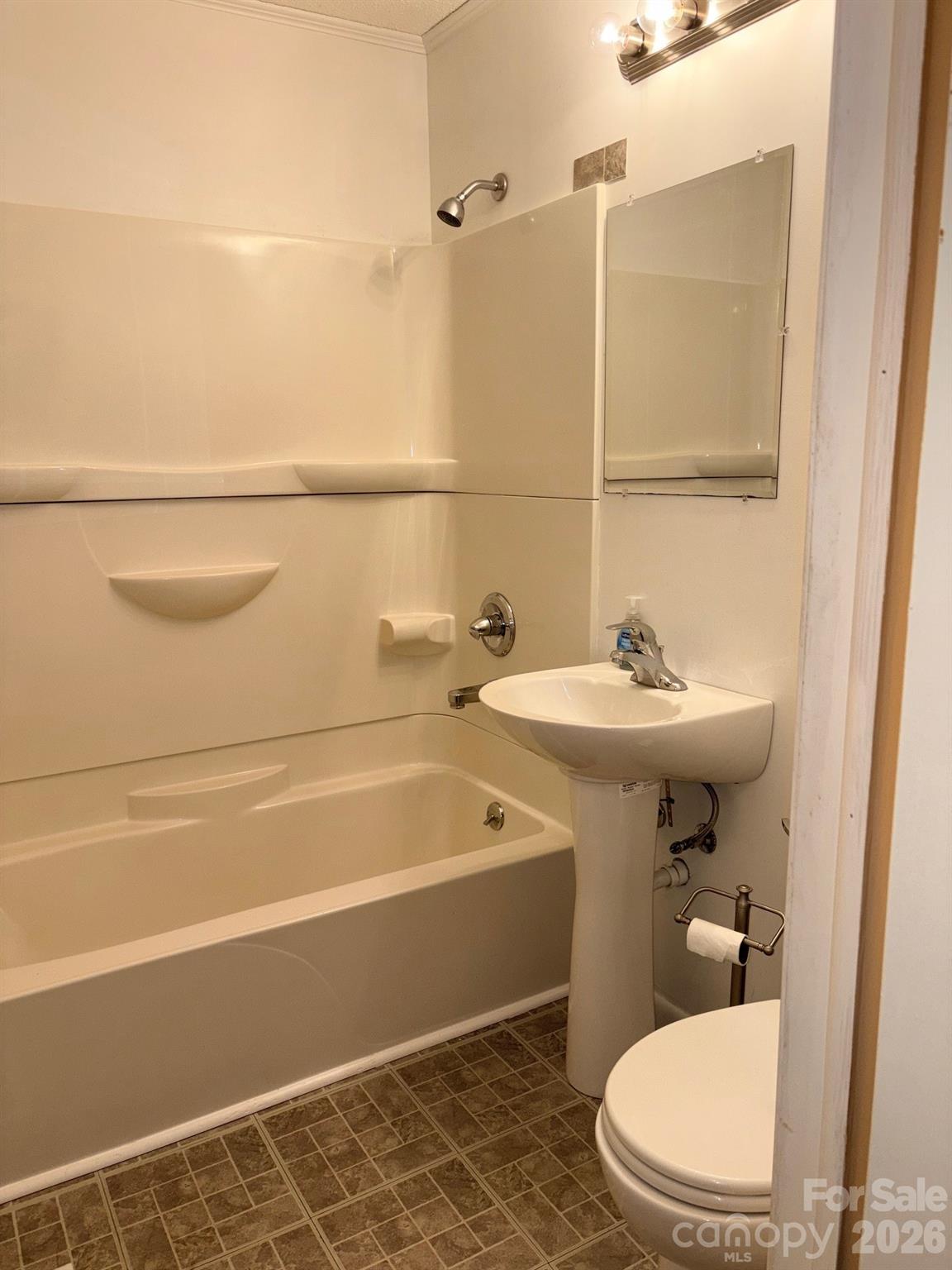 3955 Tower Road Maiden, NC 28650 - Photo 19 of 45 a bathroom with a sink a toilet and shower