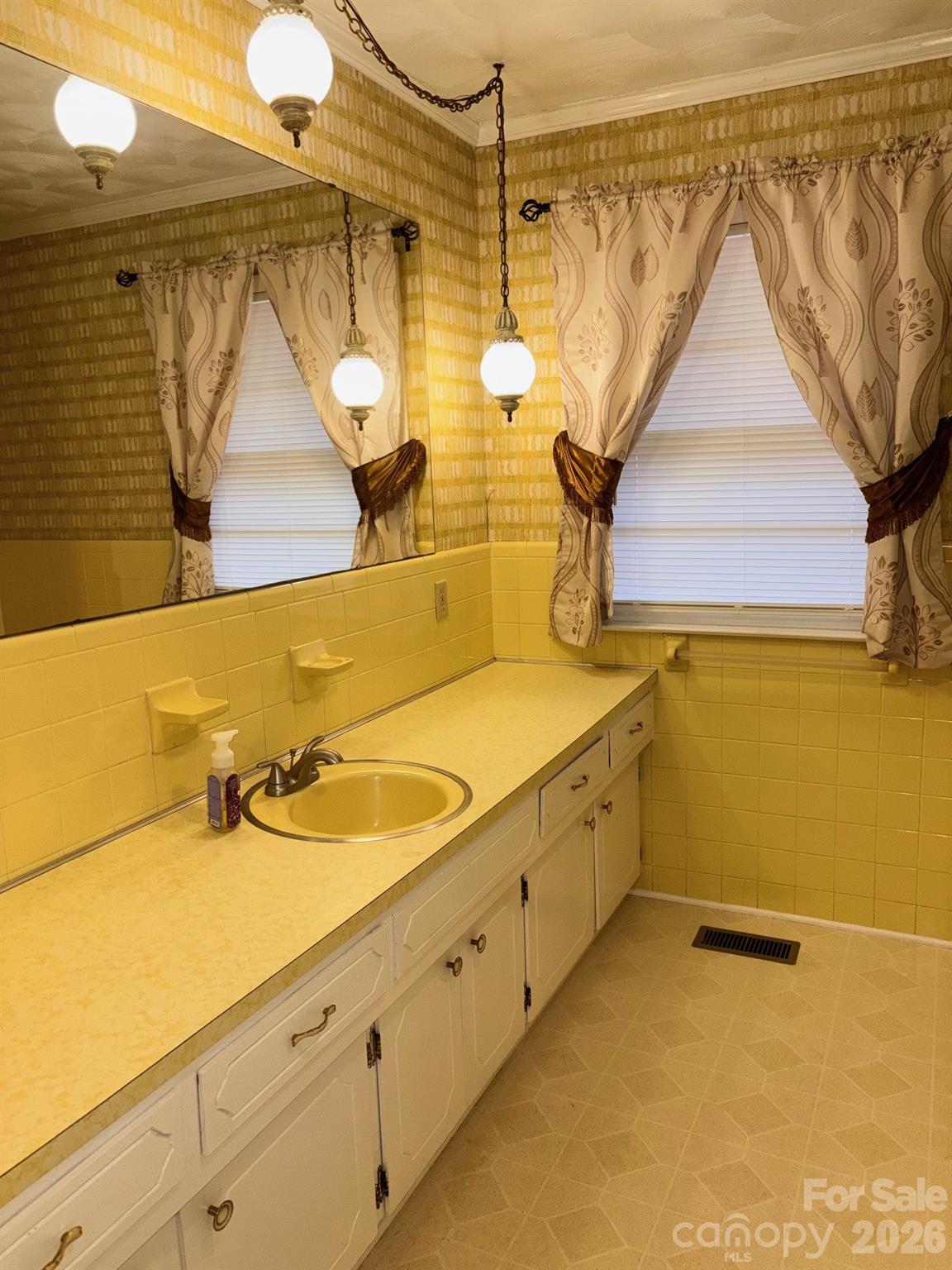 3955 Tower Road Maiden, NC 28650 - Photo 32 of 45 a bathroom with a sink and mirror