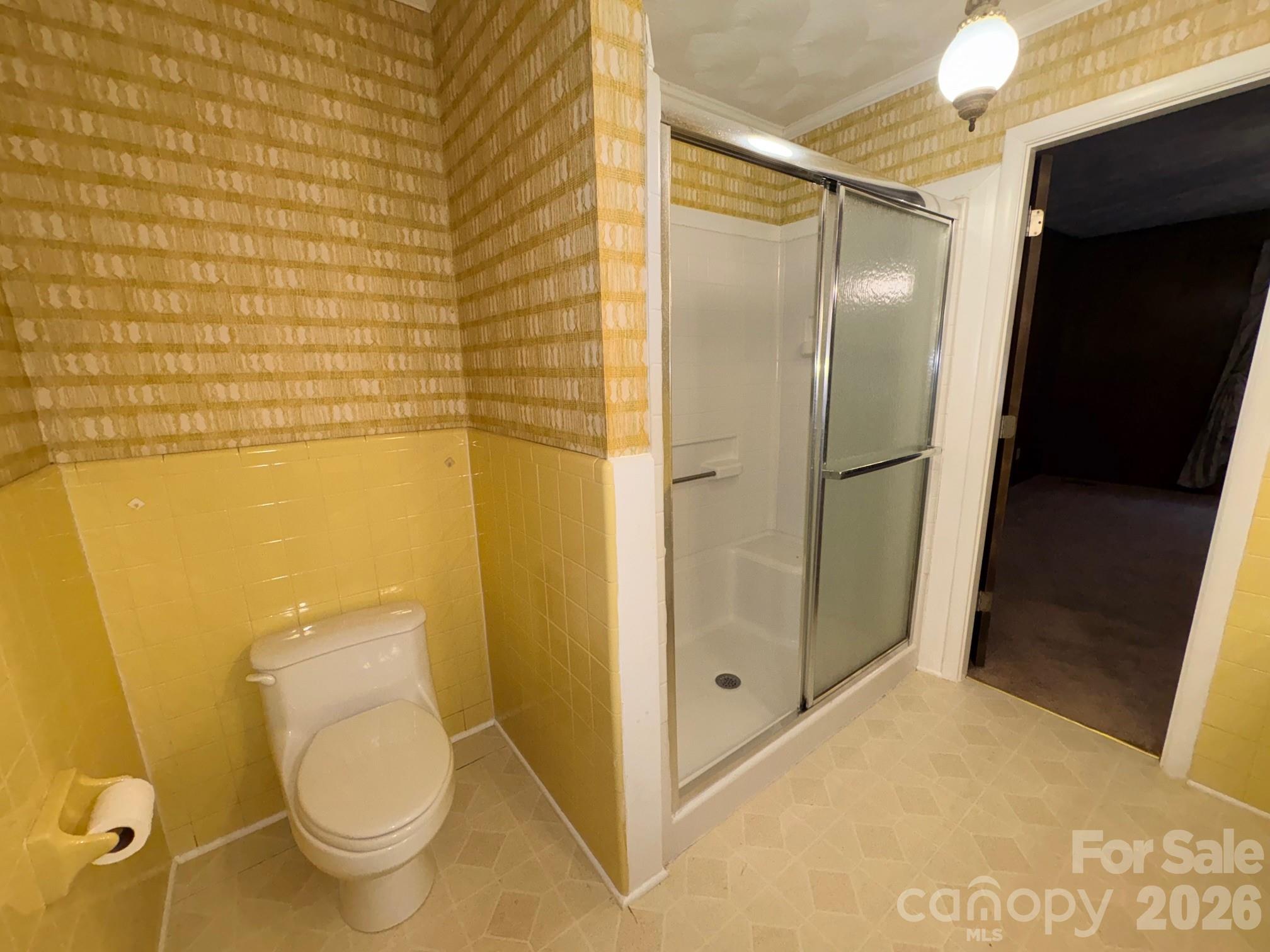 3955 Tower Road Maiden, NC 28650 - Photo 34 of 45 a bathroom with a granite countertop toilet and a shower