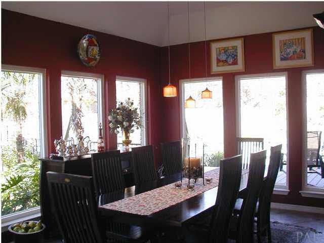 2583 Valley Road Navarre, FL 32566 - Photo 6 of 12 The sun room sits just off the kitchen and has been converted into a dining room.