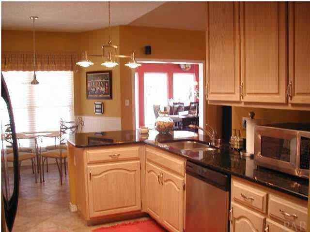 2583 Valley Road Navarre, FL 32566 - Photo 10 of 12 Here is another view of the kitchen toward the back yard.