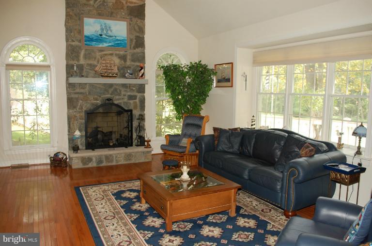 22 Riders Court Edgewater, MD 21037 - Photo 15 of 30 Family Room with Floor to Ceiling Stone Fireplace