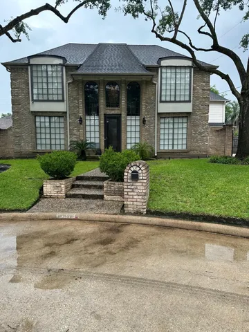 front view of a house and a yard