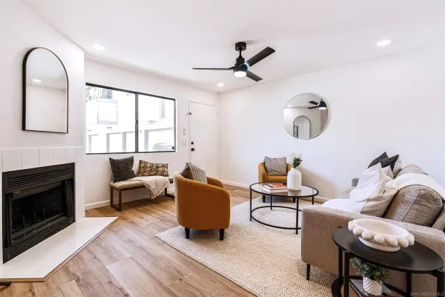 a living room with furniture and a fireplace