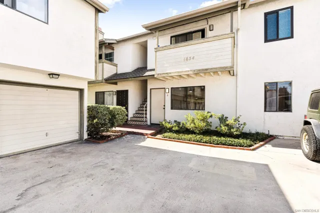 a view of a house with porch and sitting area