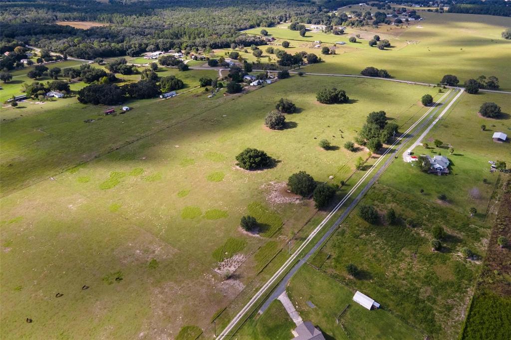 Southeast 156th Place Road Weirsdale, FL 32195 - Photo 11 of 17 an aerial view of residential houses with outdoor space