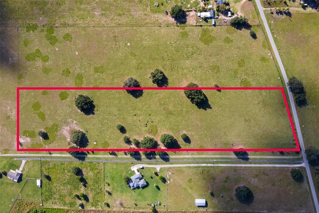 Southeast 156th Place Road Weirsdale, FL 32195 - Photo 9 of 17 a small pool with lawn chairs