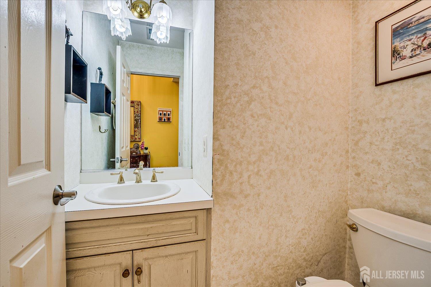 118 Coppertree Court Edison, NJ 08820 - Photo 26 of 58 a bathroom with a sink mirror and toilet
