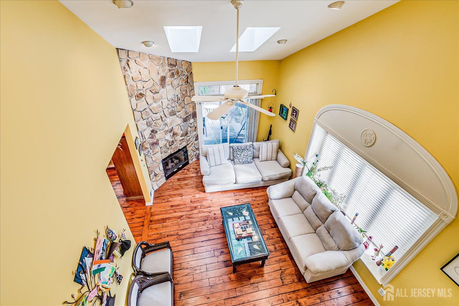 118 Coppertree Court Edison, NJ 08820 - Photo 30 of 58 a living room with furniture and a fireplace
